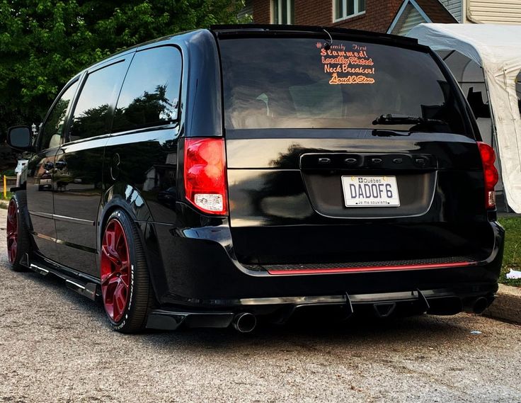 a black van parked in front of a house