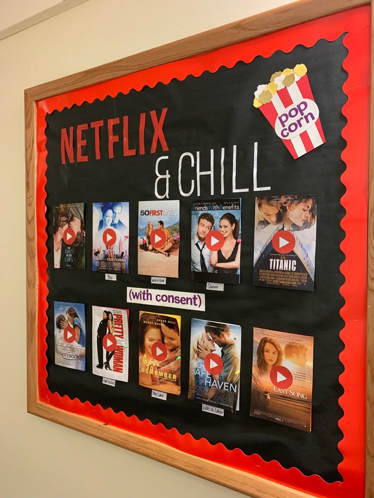 a blackboard with movie posters on it that says netflix & chill and popcorn movies