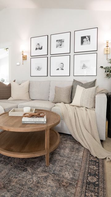 a living room filled with lots of furniture and pictures on the wall above it's coffee table