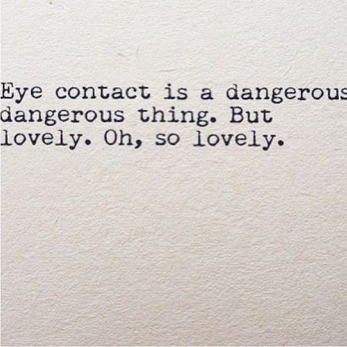 an old typewriter with the words eye contact is a dangerous dangerous thing, but lovely, oh, so lovely