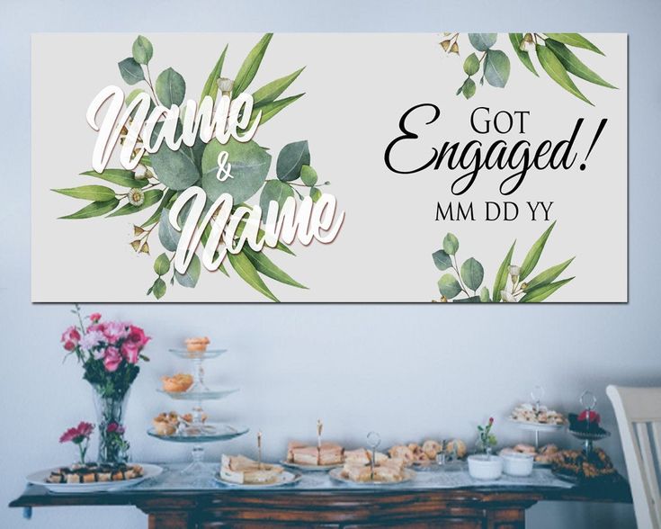a table topped with lots of food next to a sign that says welcome to engaged