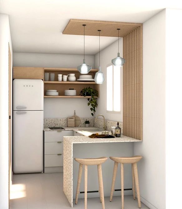 a small kitchen with two stools and a counter top in the middle of it