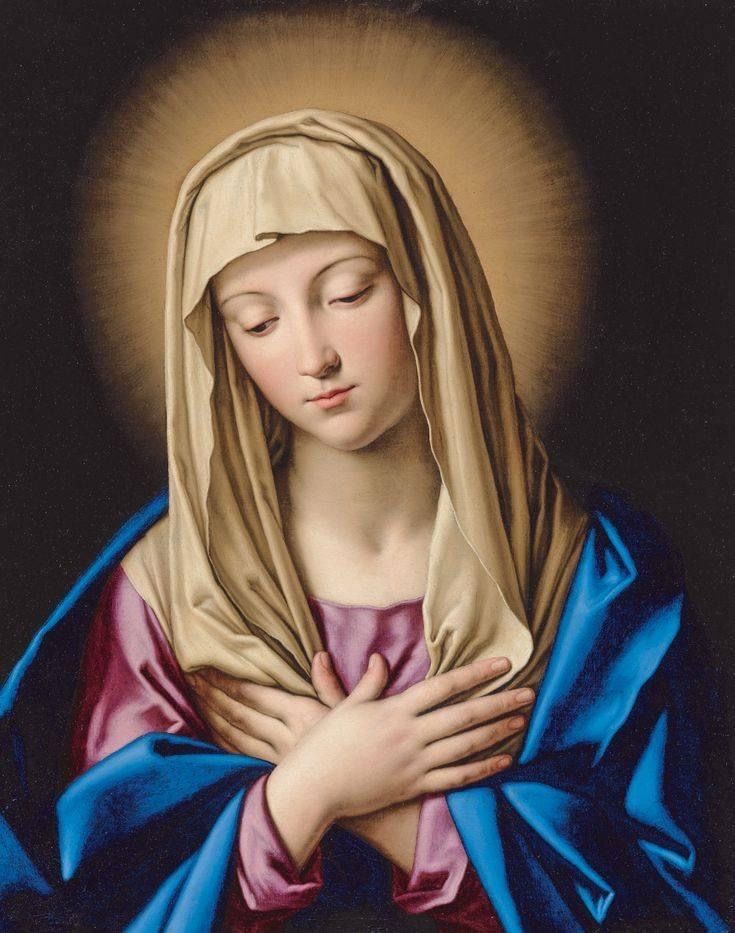 an image of the virgin mary with her hands folded up in front of her chest