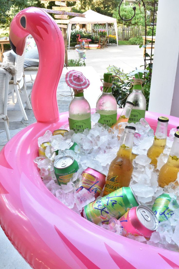an inflatable flamingo pool filled with drinks