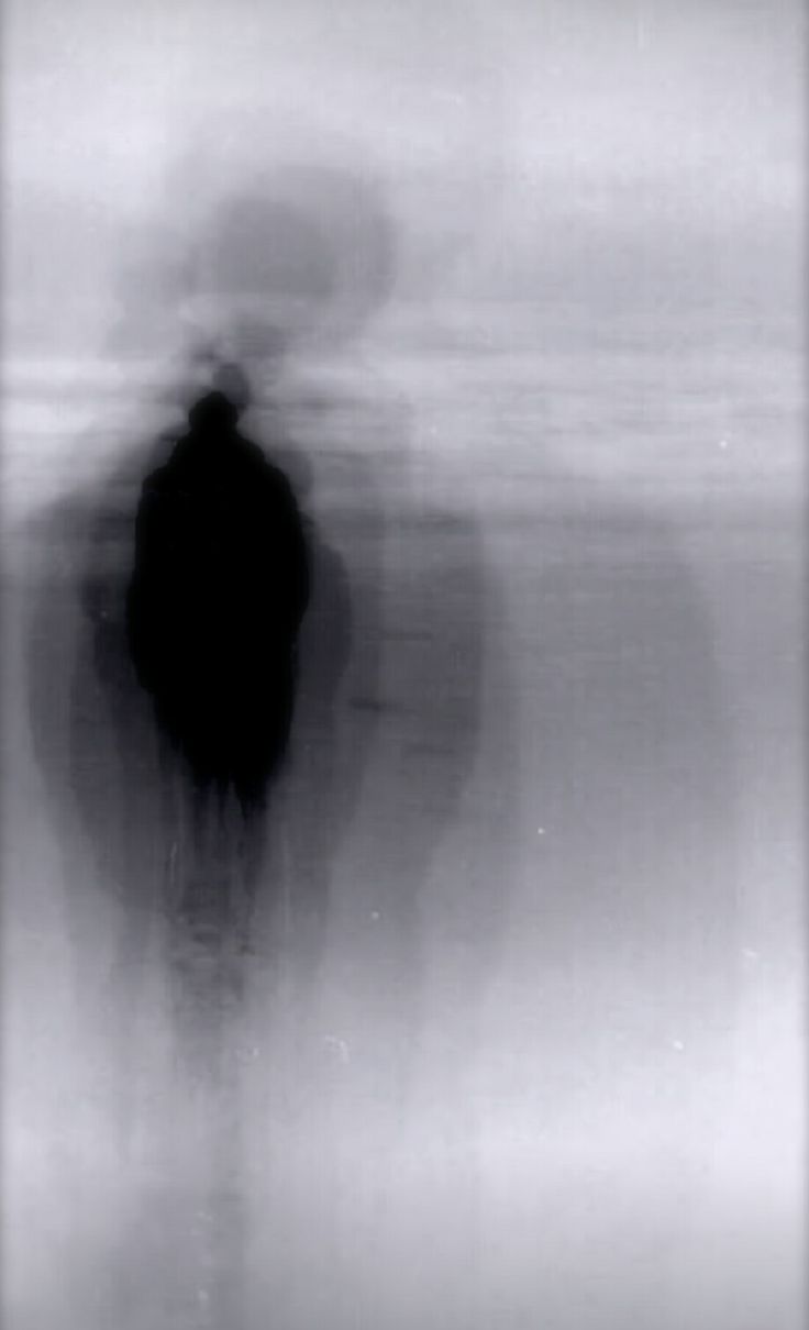 a blurry image of a person standing in the fog