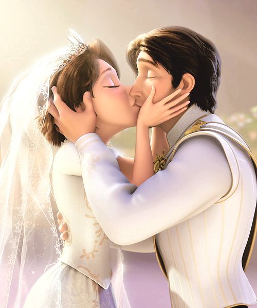 a couple kissing each other on their wedding day