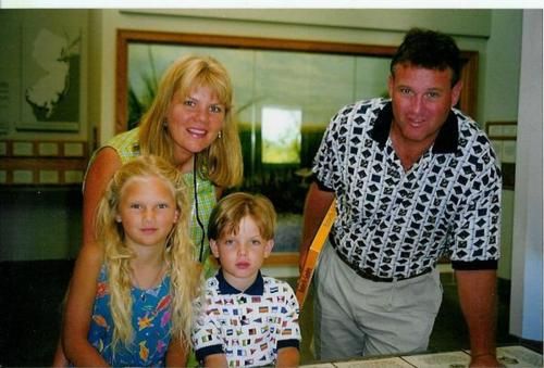 the family is posing for a photo together