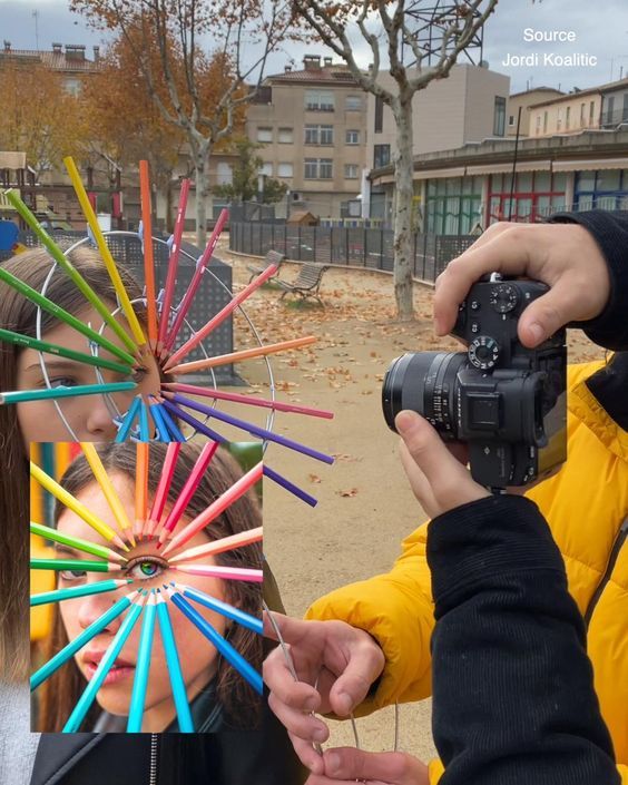 two people taking pictures of each other with colored sticks on their head and camera in front of them