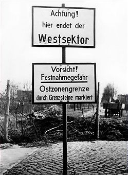 black and white photograph of street signs in german
