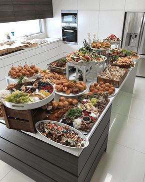 a large buffet table filled with lots of different types of food on it's sides