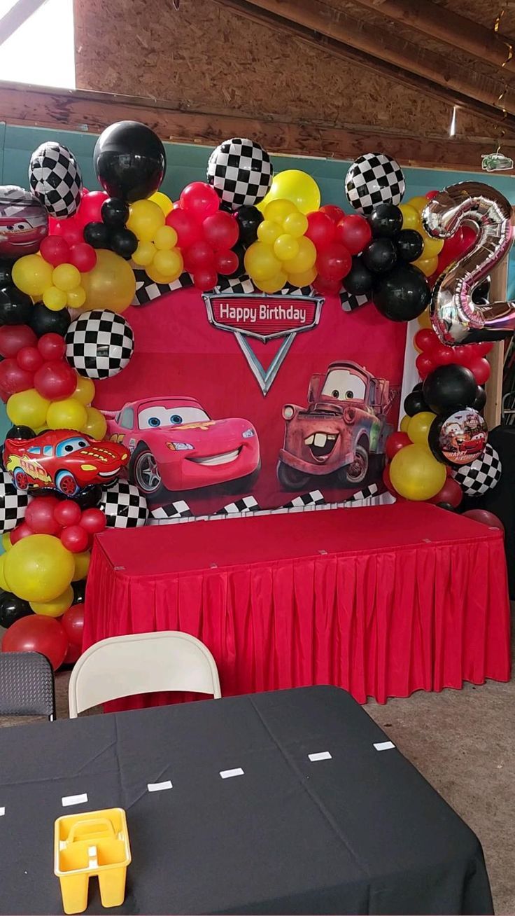 a birthday party with cars balloons and decorations