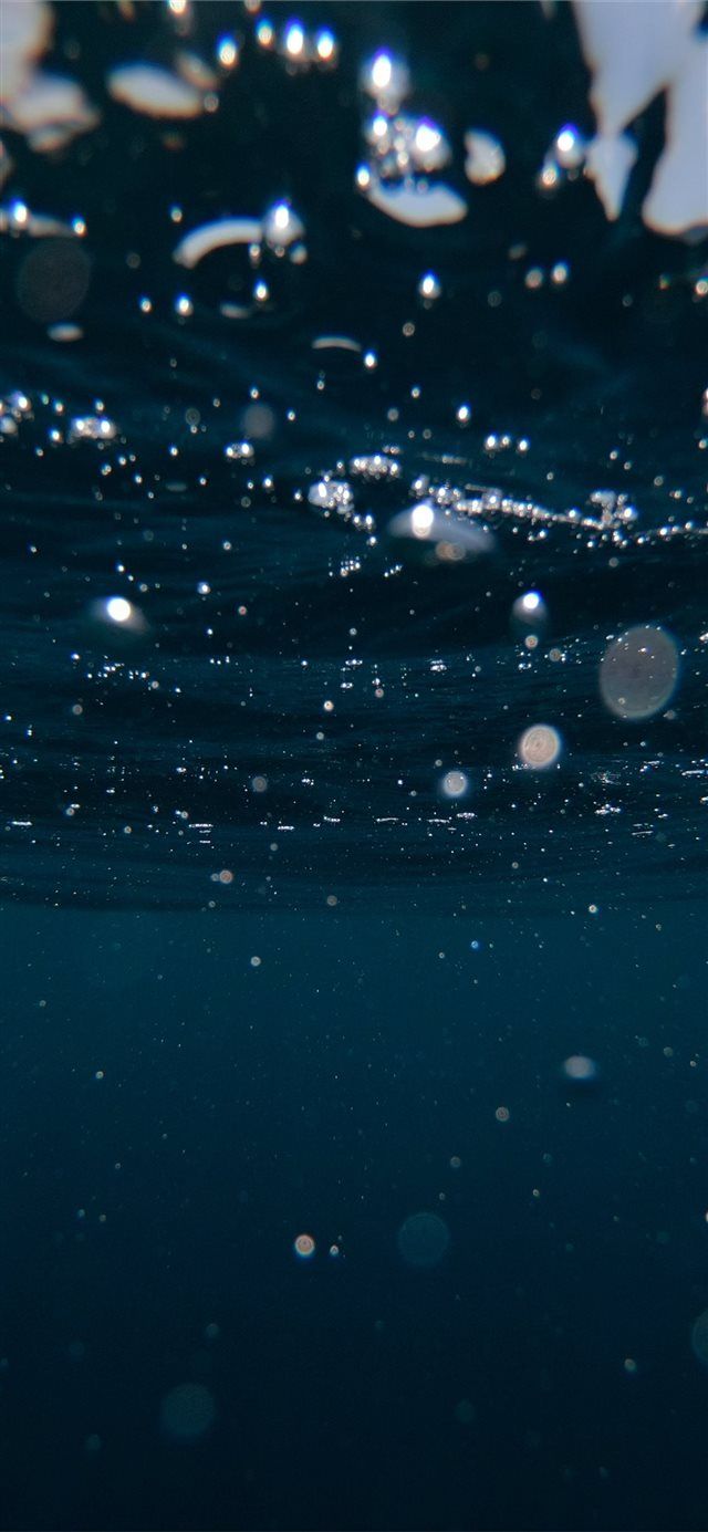 water bubbles floating in the ocean on a sunny day