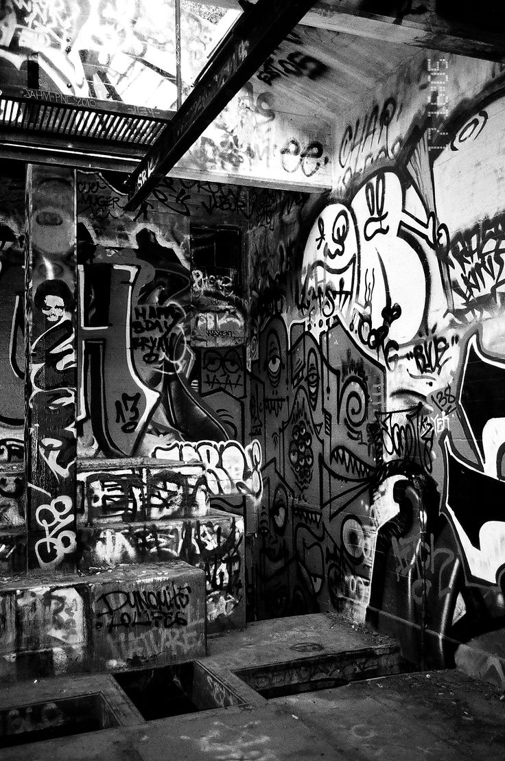 black and white photograph of graffiti covered walls