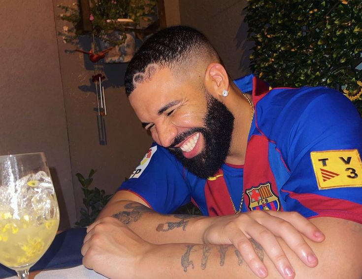 a man with a beard sitting at a table