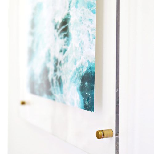 a painting hanging on the wall next to a door handle