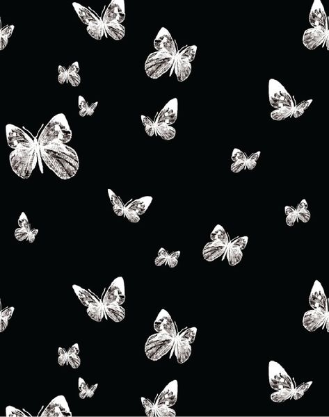 black and white butterflies are flying in the air on a black background with silver foil