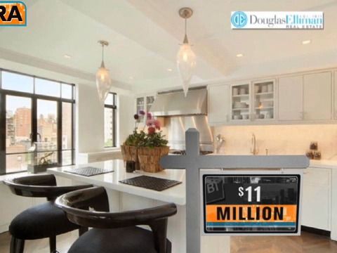 a kitchen with white cabinets and an orange license plate on the counter top that says $ 11 million