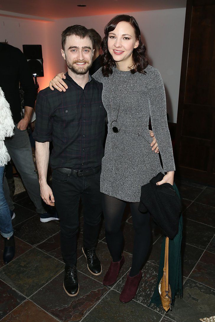 a man and woman standing next to each other