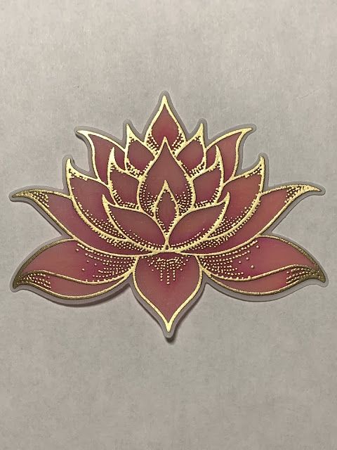 a red and gold lotus flower on a gray background