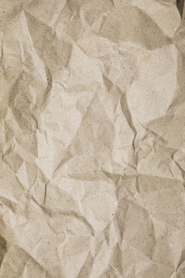 crumpled white paper with brown spots on it