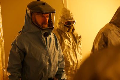 three people in protective gear standing next to each other