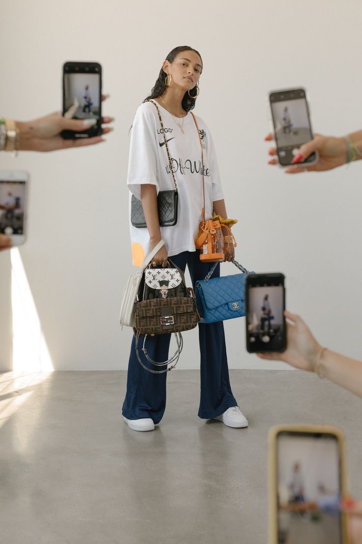 a woman is taking pictures with her cell phone