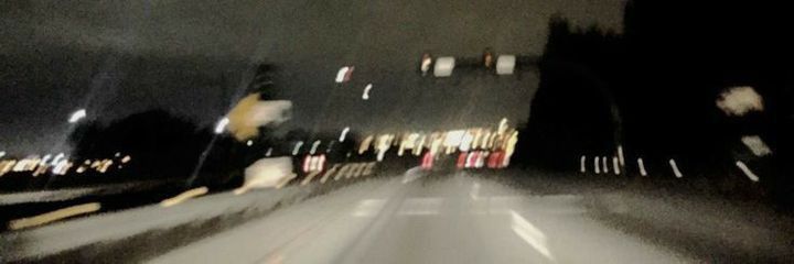 blurry photograph of street lights at night