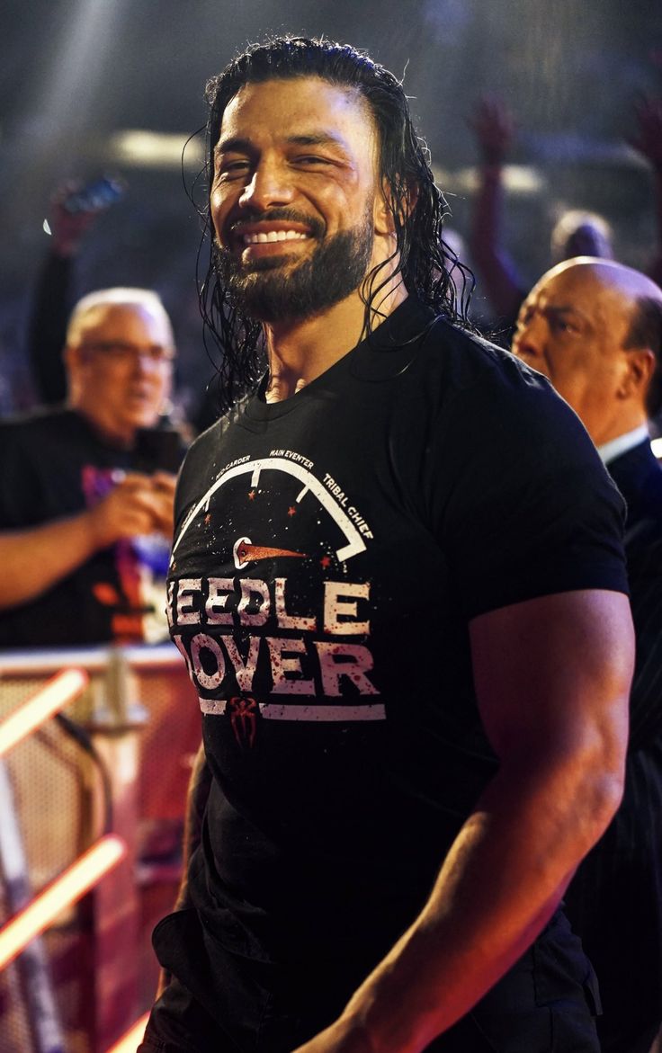 a man with long hair and beard wearing a t - shirt