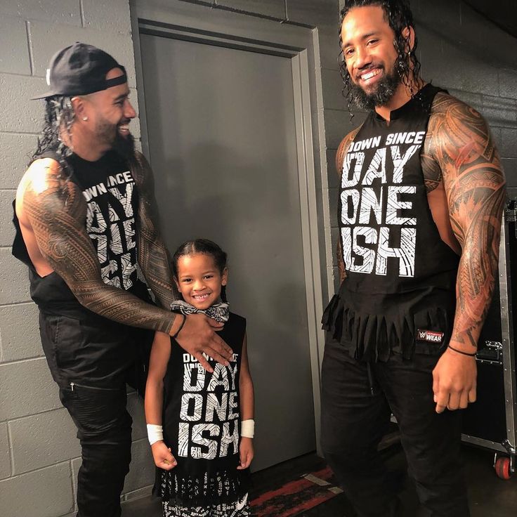 the rock and his daughter pose for a photo in their gym gear while wearing matching shirts