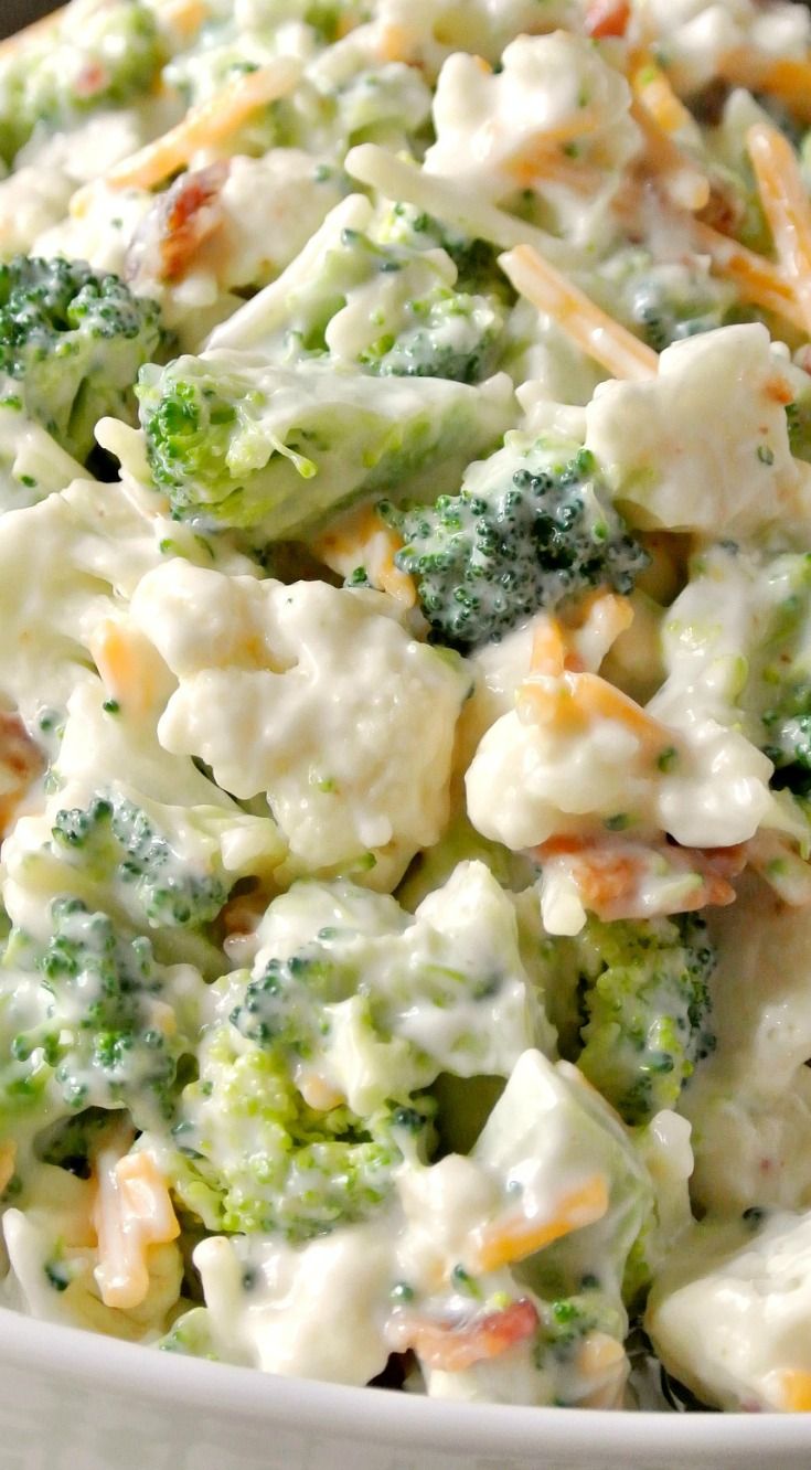 broccoli and cheese salad in a white bowl