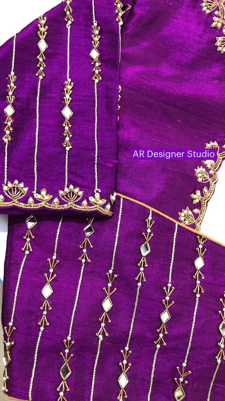two pieces of purple fabric with gold thread work on the border and beadings