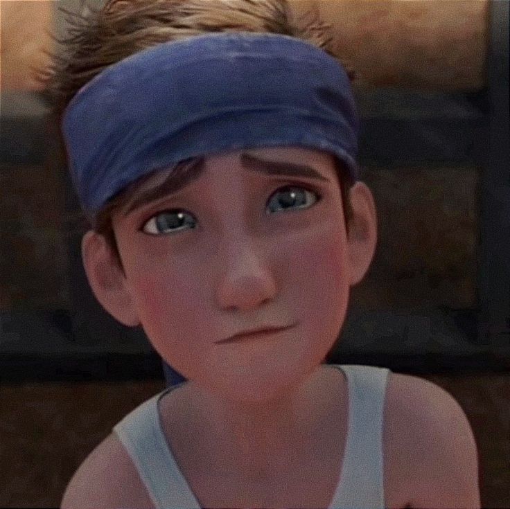 a young boy with a blue bandana on his head