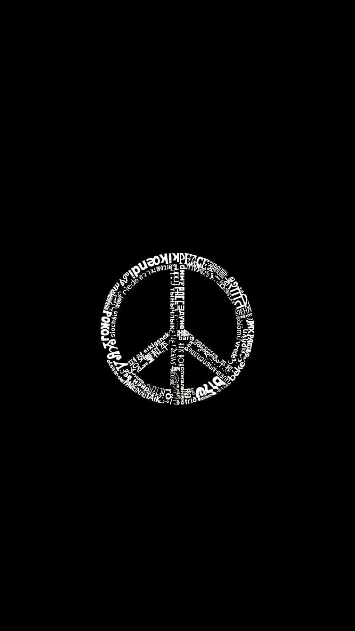 a peace sign made out of words on a black background