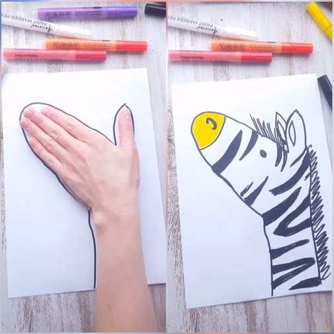 someone is drawing zebras on paper with crayons and pencils next to them