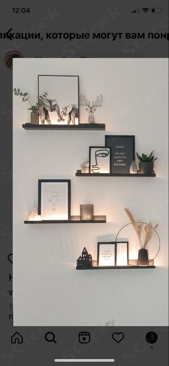 some shelves with pictures and candles on them