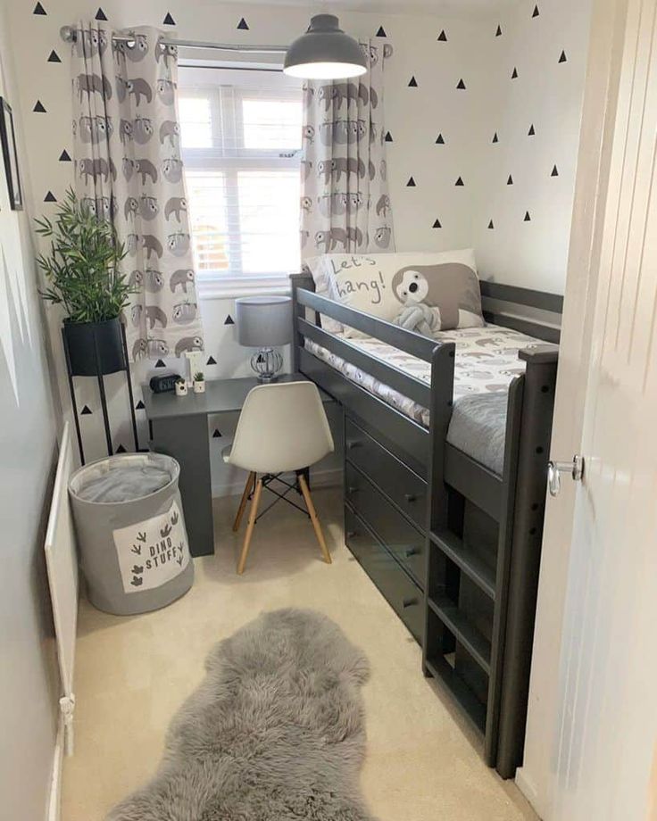 a bedroom with a bed, desk and chair next to a small child's room