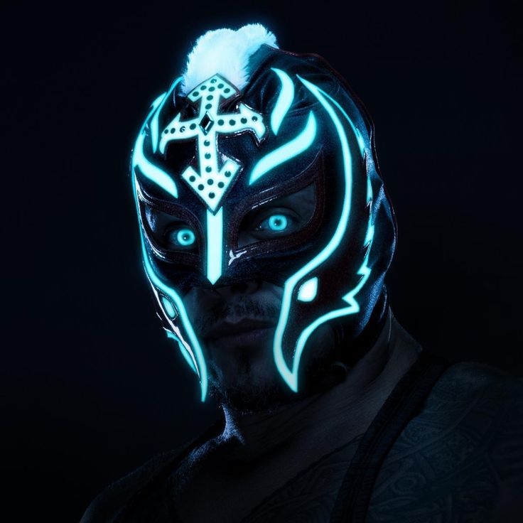 a man wearing a glowing mask with cross on it