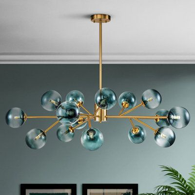 a chandelier hanging from the ceiling in a living room