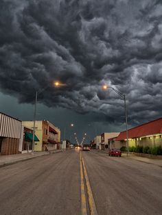 dark storm clouds loom over an empty street