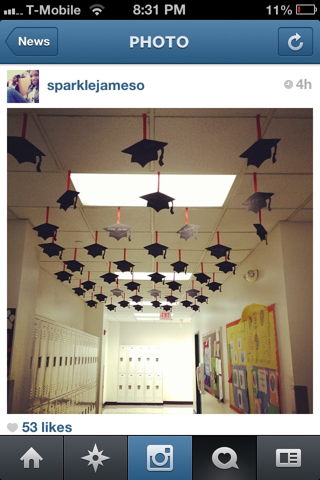 an image of graduation decorations hanging from the ceiling in a school hallway with pictures on it