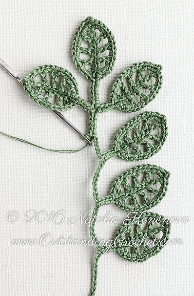 a crocheted leaf is being worked on
