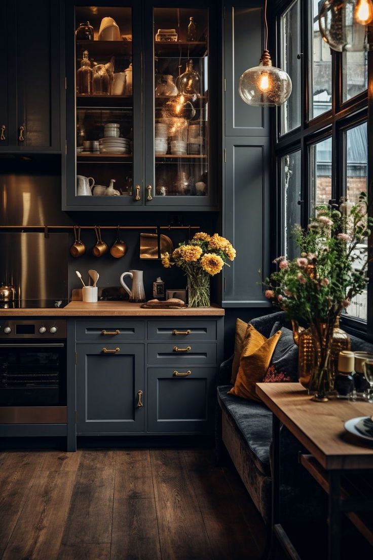 a kitchen filled with lots of counter top space next to a wooden table and window