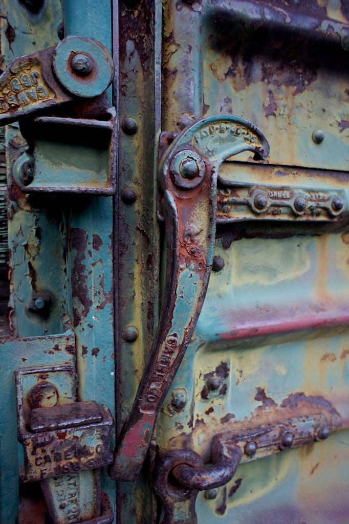 an old rusted metal door is shown