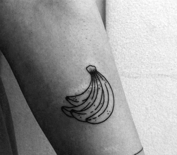 a black and white photo of a banana tattoo