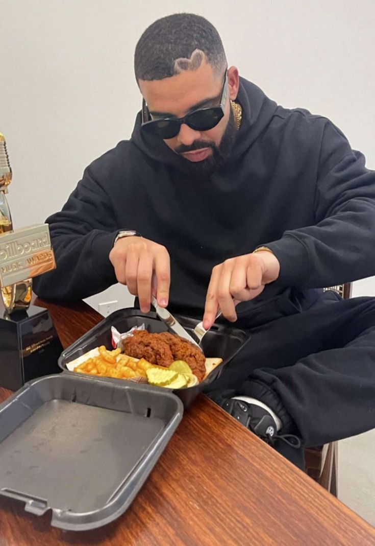 a man sitting at a table eating food