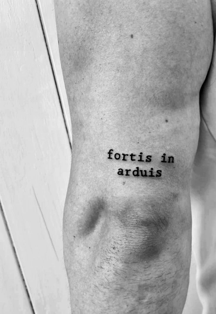 a black and white photo of a man's arm with the words, fortis in
