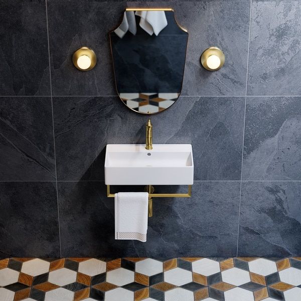 a bathroom with a sink, mirror and checkered flooring on the tile wall