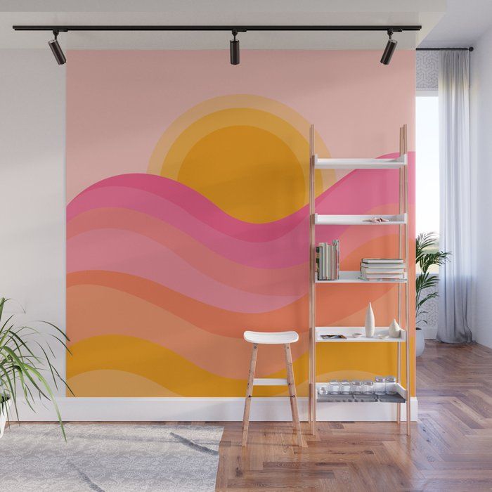 an orange and pink wall mural in a living room