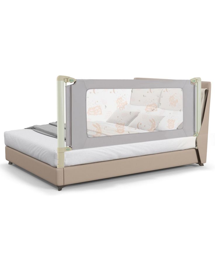 a baby crib with a mattress in the middle and two pillows on each side