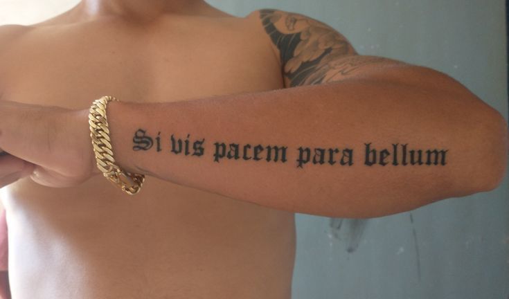 Mens Cursive Tattoo, Bible Verse Bicep Tattoo Men, Latin Forearm Tattoo Men, Cool Fonts For Tattoos For Men, Men’s Symbol Tattoos, Text Tattoo Placement Men, Watch Over Me Tattoo Letters, Men Writing Tattoo, Mens Writing Tattoos